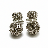 Silver knot cufflinks on a white background