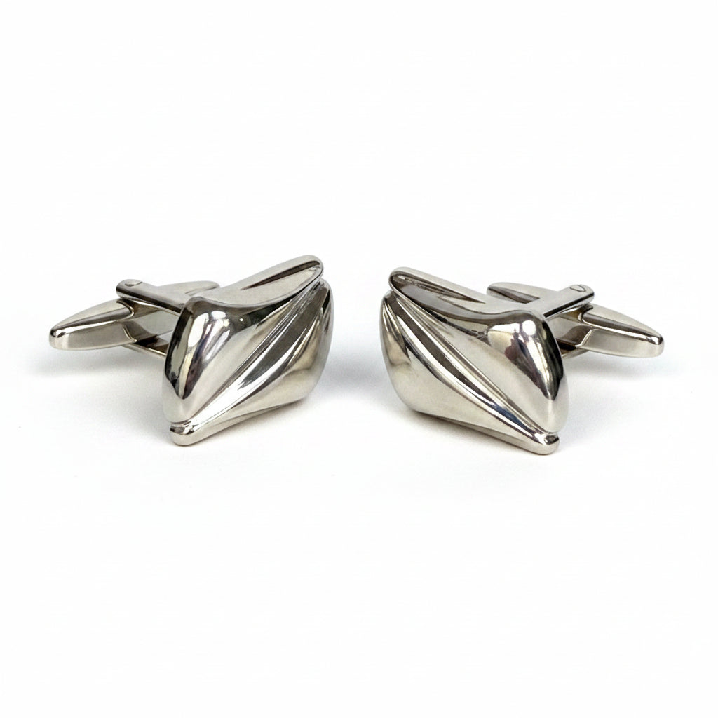 Pair of silver bow-shaped cufflinks on a white background
