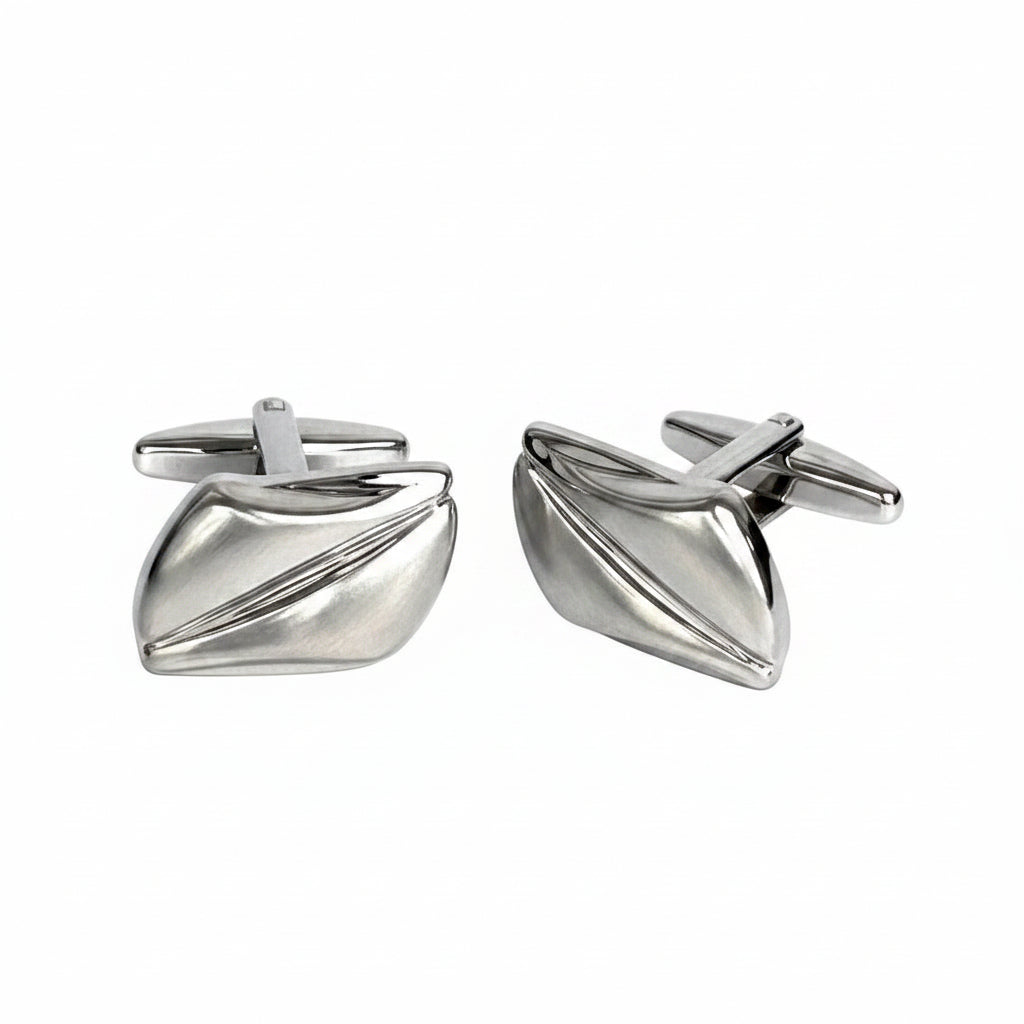 Pair of silver cufflinks on a white background