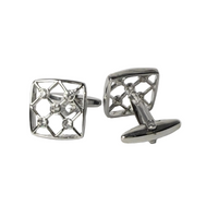 Pair of silver cufflinks with geometric design on a light gray background