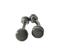 A pair of silver-toned cufflinks with round, polished dark gray to black faceted front discs, photographed on a light gray textured surface.