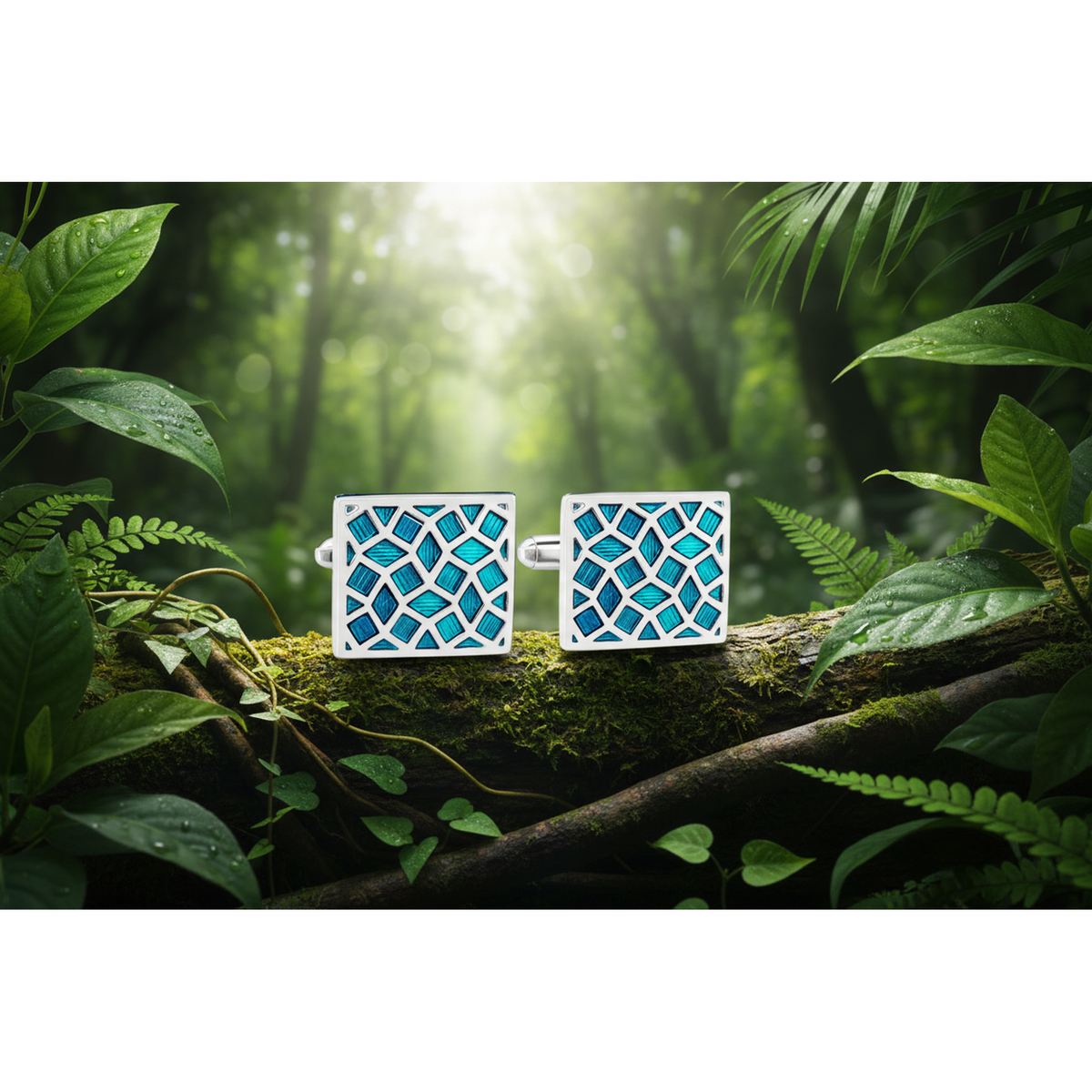 A pair of silver-tone cufflinks with turquoise enamel crack design, displayed against an outdoor backdrop.