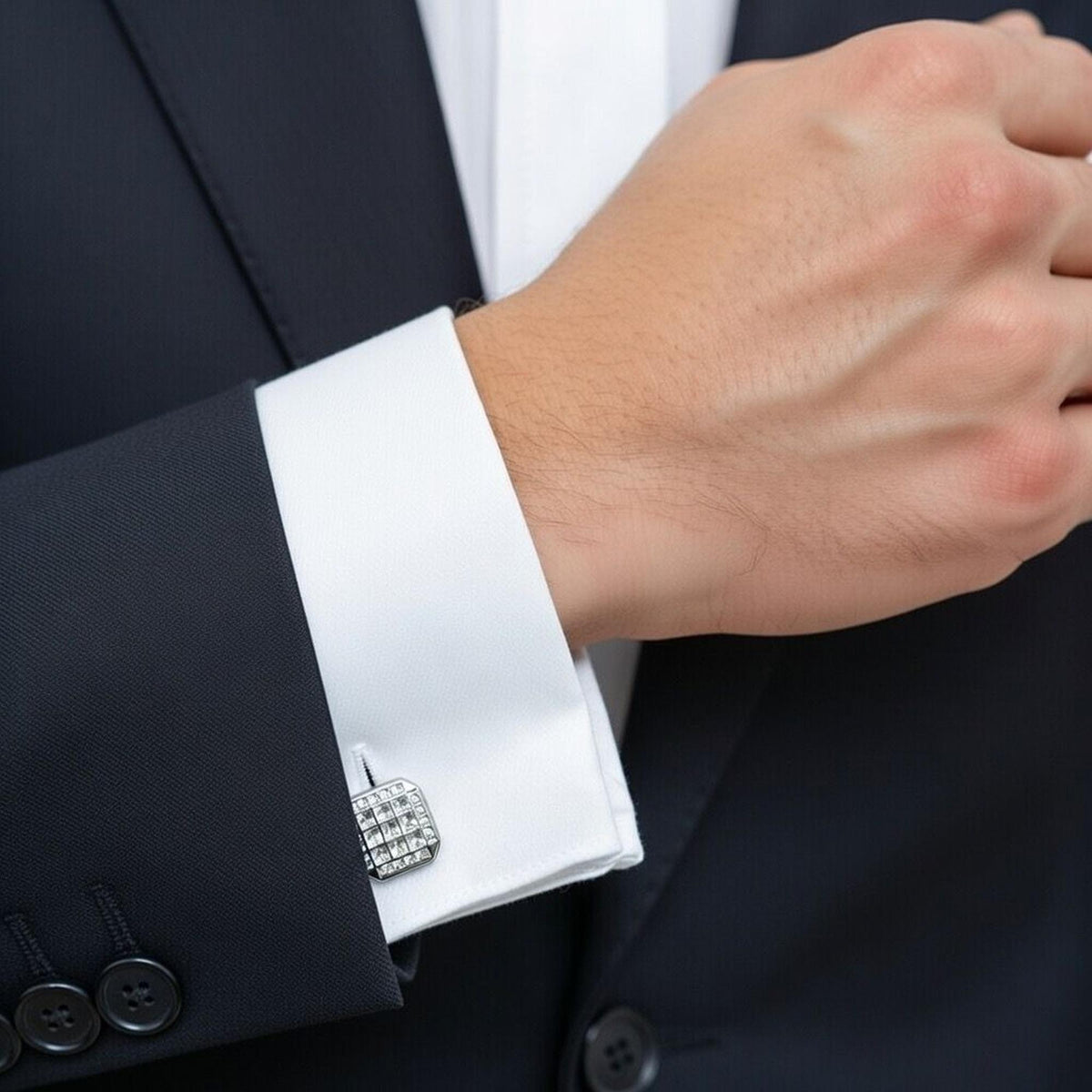 Close-up of a suit cuff with a decorative cufflink